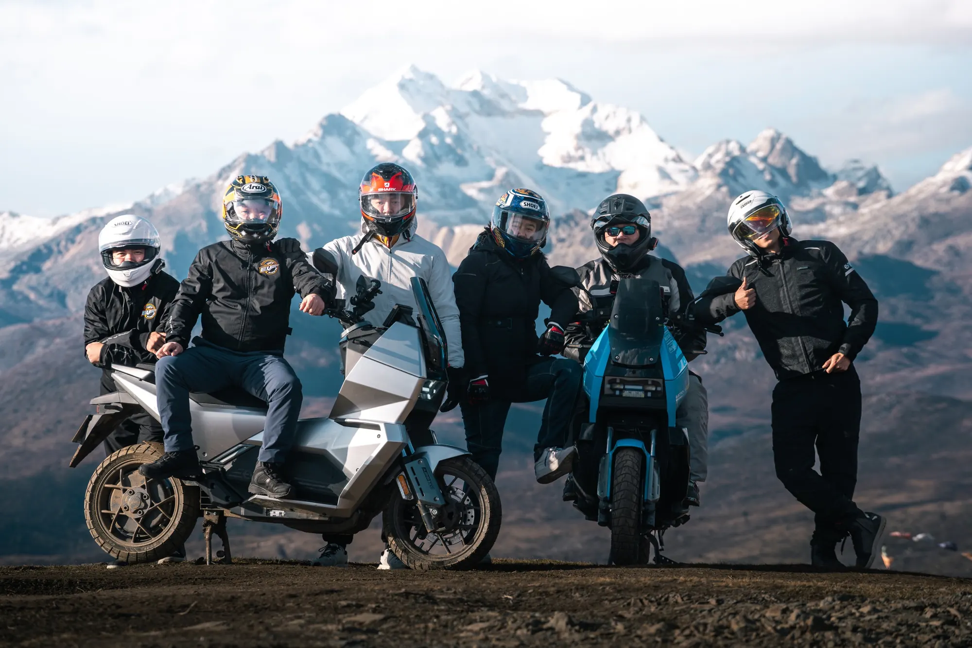 EVREV riders in mountain landscape